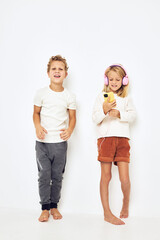 Obraz premium Image of boy and girl take a selfie light background