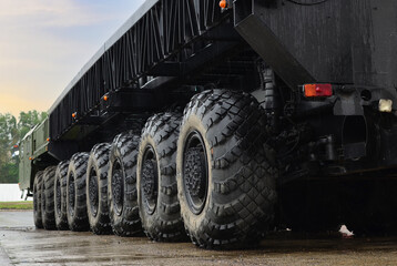 Tires of the heavy duty truck for transport missile defence system and oversized cargo. Wheeled...
