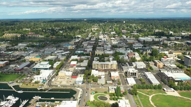 Cinematic 4K aerial drone dolly shot of the Olympia Yacht Club near the Washington State Capitol Building and Campus, Capitol Lake, with a panoramic view of Historic District in Olympia, Washington
