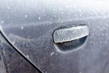 Frost ice car door. ice crystal. the ice car handle. Frozen in a handle car. Morning frost one handle car.Closeup.