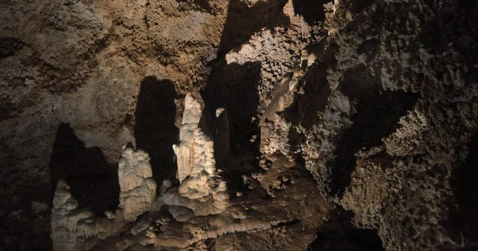 Beautiful shots of karst cave, Lipa Cave situated Serbia, East Europe. Illuminated dark cave with stalactites and stalagmites. Unique nature landscape. High quality 4k footage