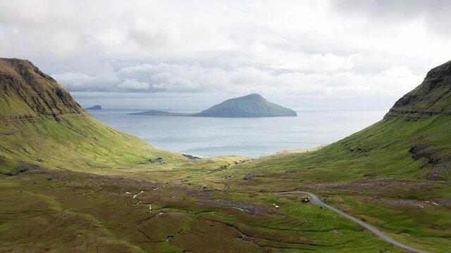 Aerial view of wilderness nature,islands, ocean, green mountain and rock cliffs.Impressions of the fascinating archipelago of the Faroe Islands in the North Atlantic Ocean