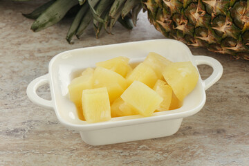 Marinated pineapple slices in the bowl