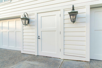 Front door exterior in between two wall lamps at La Jolla, California