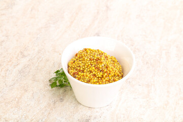 Grain mustard sauce in the bowl