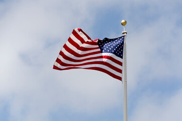stars and stripes flag waving at the wind in United states of America