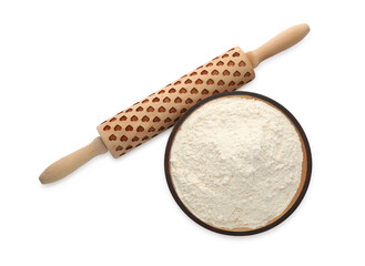 Wooden rolling pin and bowl with flour on white background, top view