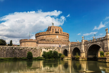 View of the Castle of the Holy Angel, aka Hadrian's Castle and the bridge of the Holy Angel across the Tiber River. Rome, Italy