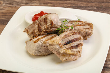 Grilled pork tenderlion with tomato sauce