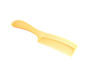 An image isolated yellow comb plastic accessory for hairdresser or hair on beauty in beauty shop or home on the white background with clipping path.