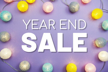 Year End Sale Promotion text with LED cotton balls on purple background