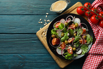 Fototapeta na wymiar Concept of tasty food with vegetable salad with tahini sauce on wooden background