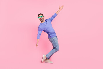 Full body profile photo of brunet cool guy dance wear eyewear pullover jeans shoes isolated on pink...