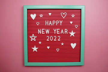 Happy New Year 2022 alphabet letters on pink background