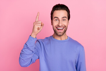 Photo of beard cool guy index up wear blue pullover isolated on pastel pink color background