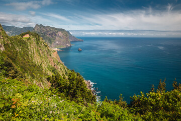 Fototapeta na wymiar The green coast of Madeira, photographed in the morning light.