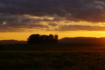 Sunset in the Sauerland. Landscape with setting sun in the evening.