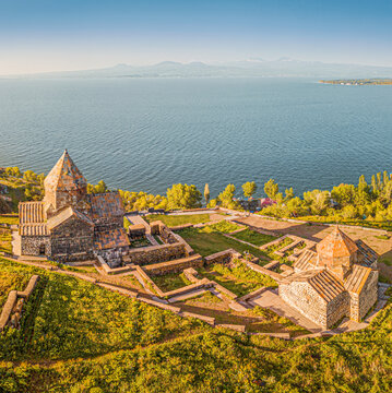 Aerial panoramic view to Sevanavank Monastery and chapel overlooking famous Sevan lake at sunny spring day. Travel and tourist destinations of Armenia