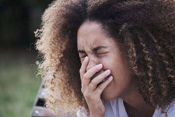 Close up face of crying African American woman suffering psychological problem feeling mental pain grief. Frustrated young lady covering mouth by hand having stress despair solitude emotion outdoor