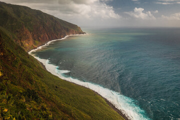 The green coast of Madeira over the Atlantic Ocean photographed in spring.