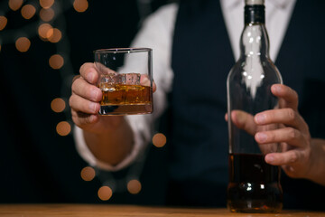Barman pouring whiskey whiskey glass beautiful night