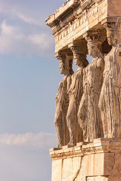 Caryatids and blue sky. The Erechtheion (Temple of Erechtheum) on Acropolis of Athens, Greece