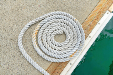 Close up of a spiral rope on a concrete dock at Oceanside, California