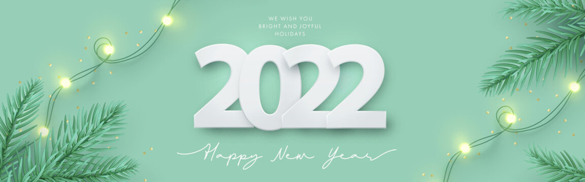 Happy New Year 2022 design. Light green background with paper cuted 2022, realistic pine branches and garland lights. Horizontal poster, greeting card, banner, website header in modern minimal style