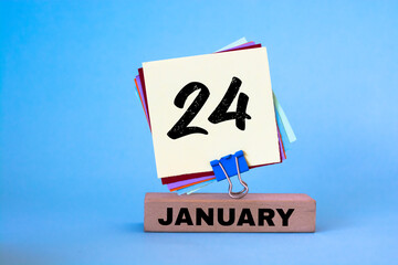 January 24th. Day 24 of month, calendar on blue background. Winter time.