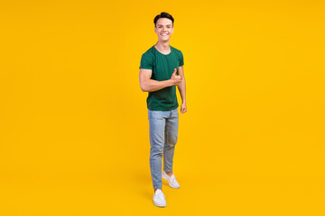 Fototapeta na wymiar Full body photo of cheerful happy positive man hold hand thumb up smile enjoy isolated on yellow color background