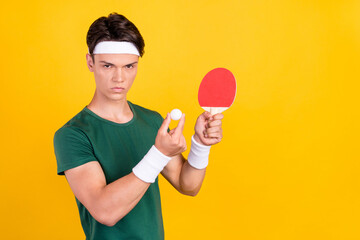 Photo of young charming angry unhappy man hold hands ball tennis game isolated on yellow color background