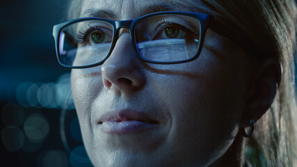 Close-up Portrait of Female Software Engineer Working on Computer, Programming Reflecting in Glasses. Developer Working on Innovative e-Commerce Application using Machine Learning, AI, Big Data - obrazy, fototapety, plakaty