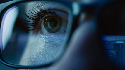 Super Close-up on Female Eye, Software Engineer Working on Computer, Programming Reflecting in...