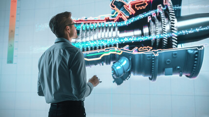 Innovative Green Energy Startup: Engineer Designing Engine Using Tablet Computer and Big Wall Screen to Analyse Prototype. Concept for Sustainable Environmnetally Friendly Zero Emissions Turbine