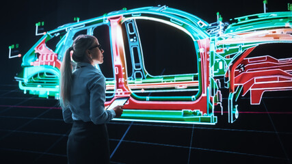 Naklejka premium Innovative Green Energy Startup: Female Engineer Designing Electric Car Using Tablet Computer and Big Wall Screen to Analyse Prototype. Concept for Sustainable Zero Emissions Carbon Neutral Vehicle