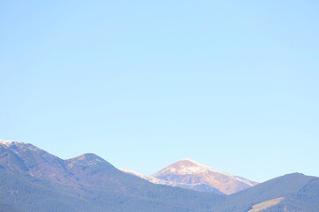 Aerial view of beautiful mountain landscape with forest and snow