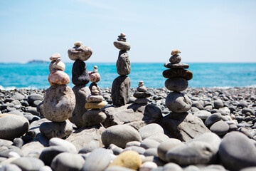 Large pyramids of stones on the seashore