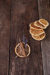 Decor with dried oranges on a wooden background