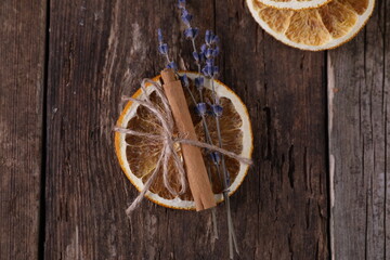 Decor with dried oranges on a wooden background