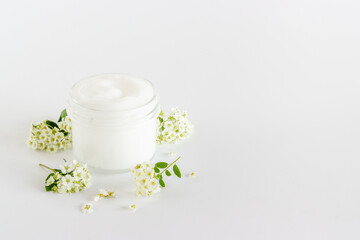 White spa medical herbal cosmetic with blossoms flowers