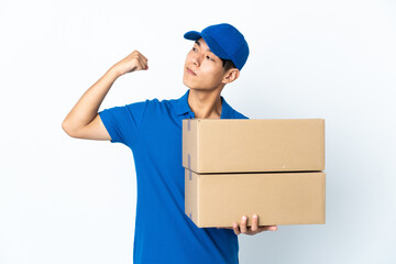 Delivery Chinese man isolated on white background doing strong gesture