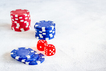 Red dices and gambling chips for poker. Casino games background