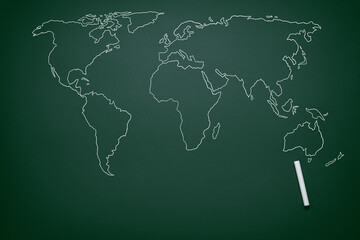 world map drawn in chalk on a school blackboard, travel geography study concept, earth day background