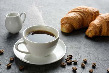 hot coffee with croissants close-up.