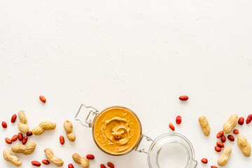 Homemade creamy peanut butter with nuts, top view