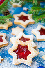 Linzer cookies. Traditional Christmas Austrian cookies with red jam sprinkled with powdered sugar on top. Copy space.