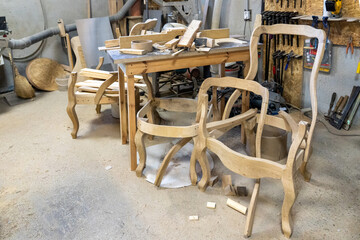 Photo of a handmade wooden chairs in the workshop. Wood products