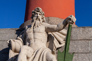 Rostral column on Vasilievsky Island in St. Petersburg with a sculpture of Poseidon	
