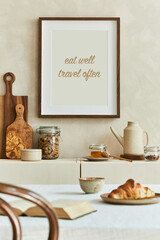Creative and modern dining room interior design with mock up poster frames, beige sideboard, family dining table and retro inspired personal accessories. Copy space. Template. Autumn vibes..