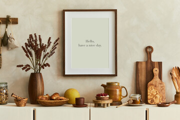 Stylish and modern kitchen interior composition with mock up poster frame, beige wooden sideboard,...